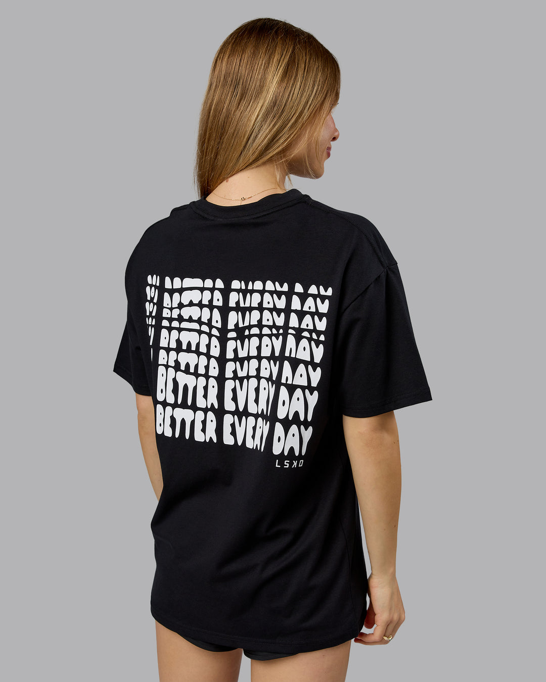Woman wearing On Repeat FLXCotton Oversized Tee - Black-White | Model:Emilie | Size:XS