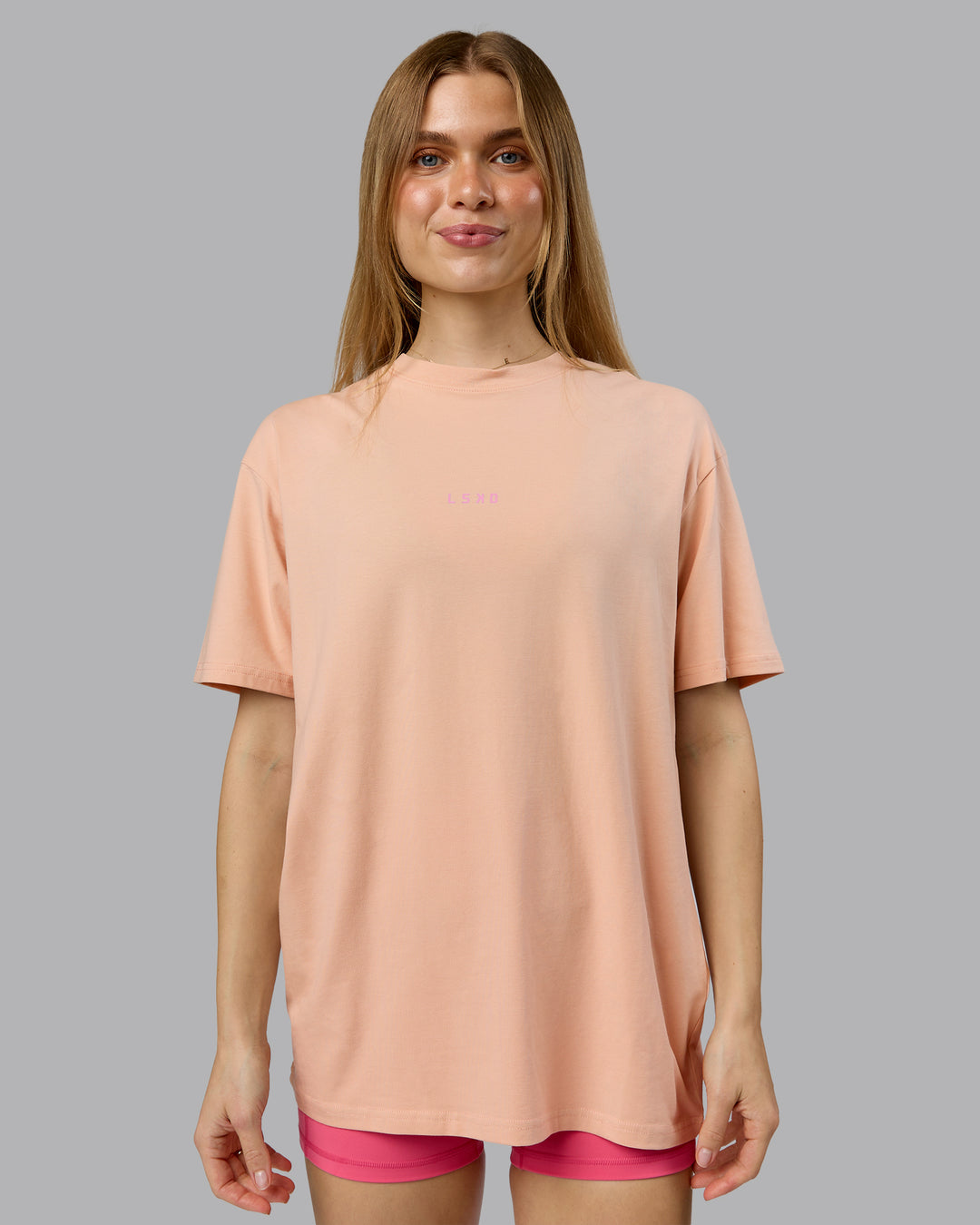 Woman wearing On Repeat FLXCotton Oversized Tee - Cameo Rose-Candy Pink | Model:Emilie | Size:XS