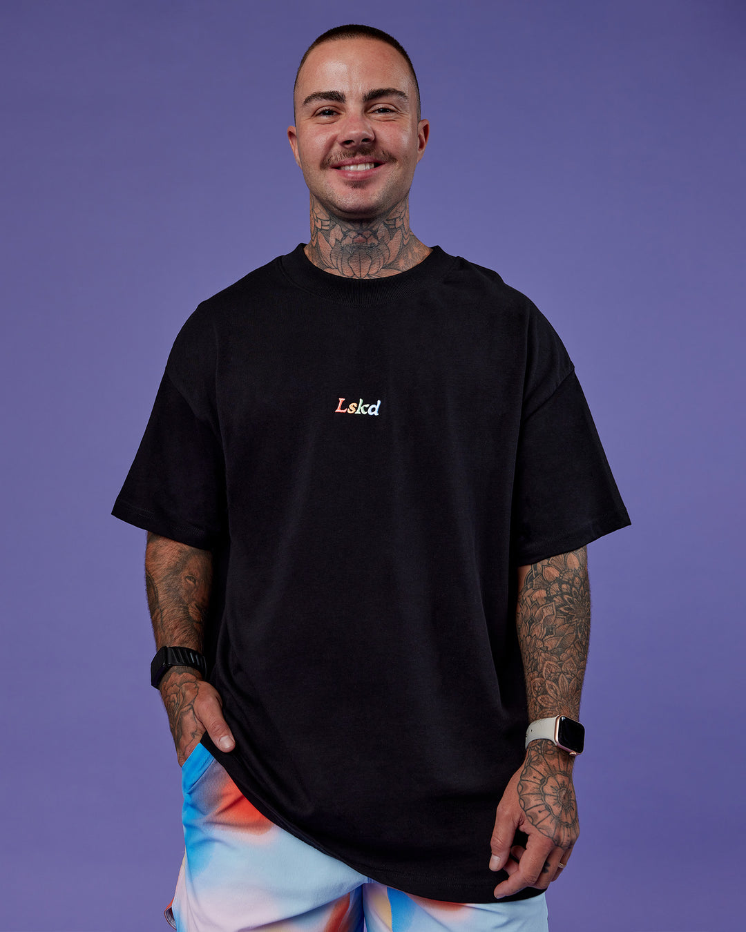Man wearing Our Journey Heavyweight Oversized Tee - Black-Rainbow | Model:Tayden | Size:XS