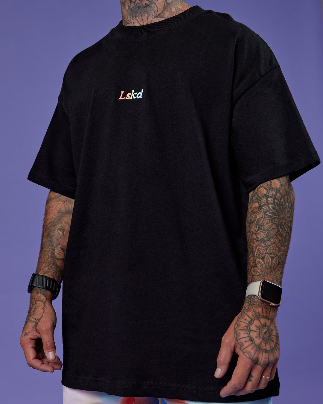 Man wearing Our Journey Heavyweight Oversized Tee - Black-Rainbow | Model:Tayden | Size:XS