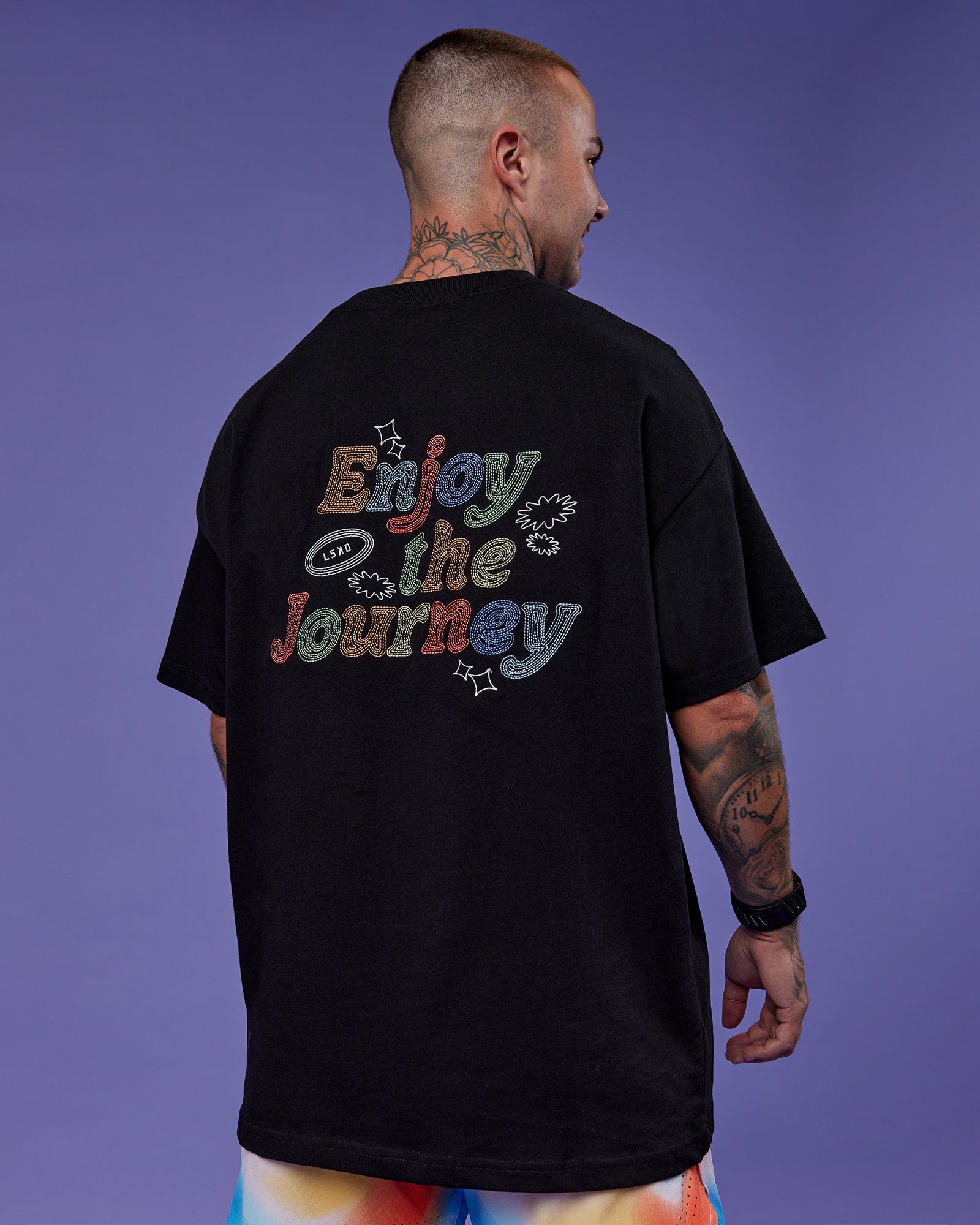 Man wearing Our Journey Heavyweight Oversized Tee - Black-Rainbow | Model:Tayden | Size:XS