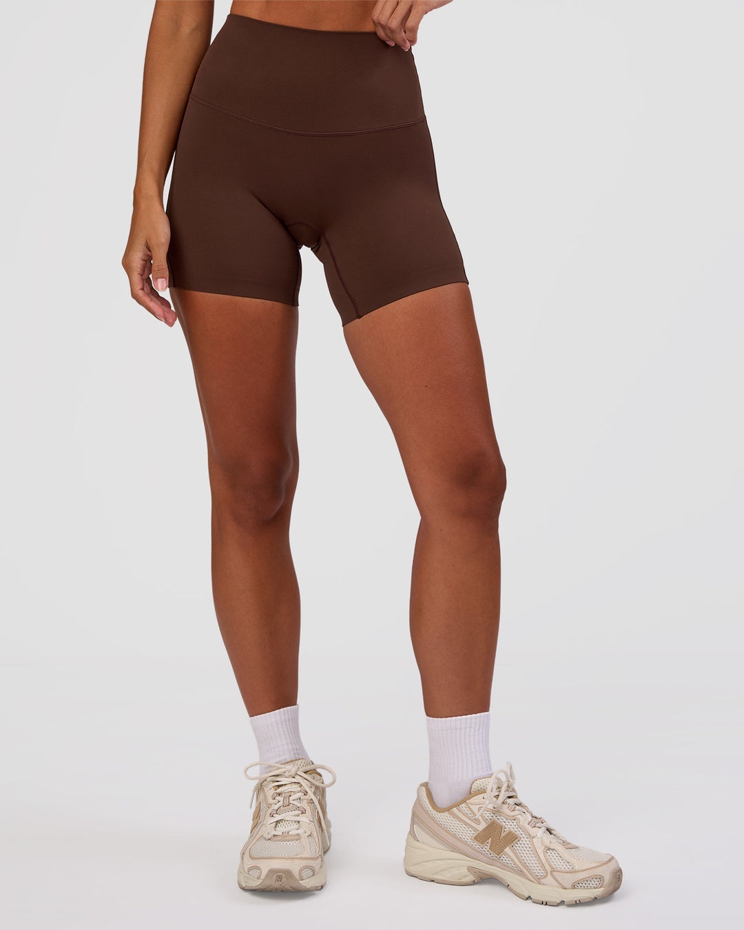 Woman wearing Peaches Elixir High-Rise 6” Short - Hot Chocolate | Model:Brylee | Size:XS