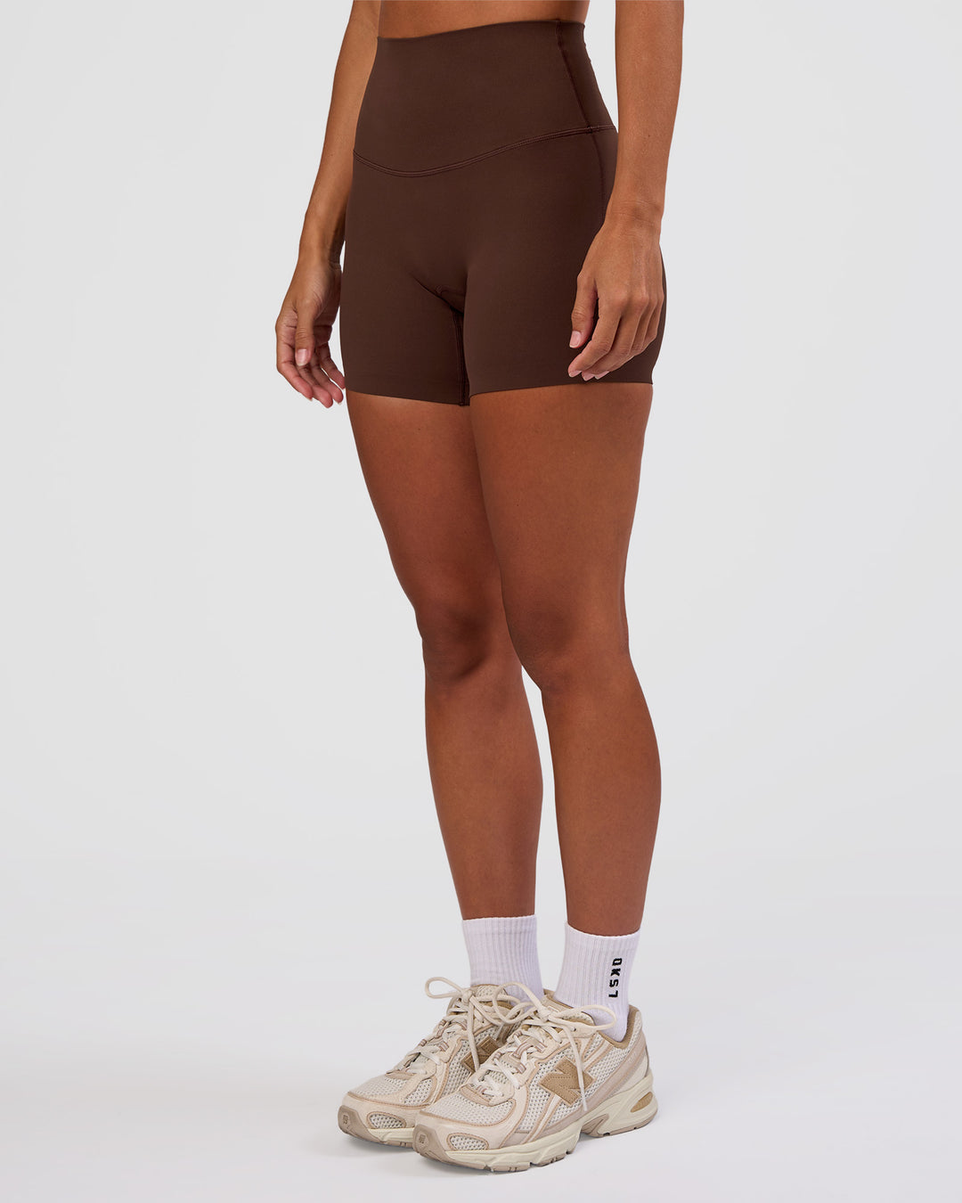 Woman wearing Peaches Elixir High-Rise 6” Short - Hot Chocolate | Model:Brylee | Size:XS