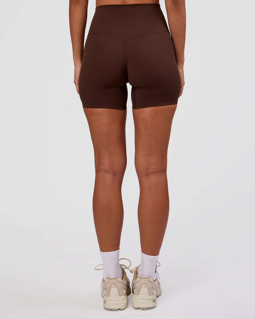Woman wearing Peaches Elixir High-Rise 6” Short - Hot Chocolate | Model:Brylee | Size:XS