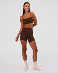 Woman wearing Peaches Elixir High-Rise 6” Short - Hot Chocolate | Model:Brylee | Size:XS