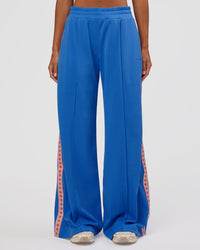 Woman wearing Peaches Track Pant - Palace Blue | Model:Brylee | Size:XS
