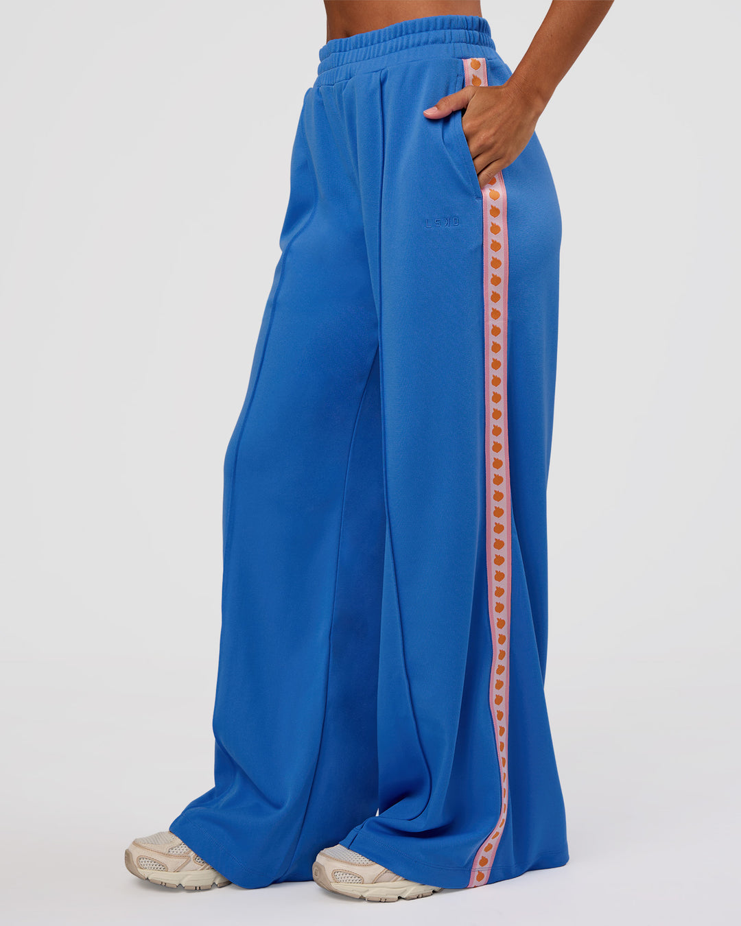 Woman wearing Peaches Track Pant - Palace Blue | Model:Brylee | Size:XS