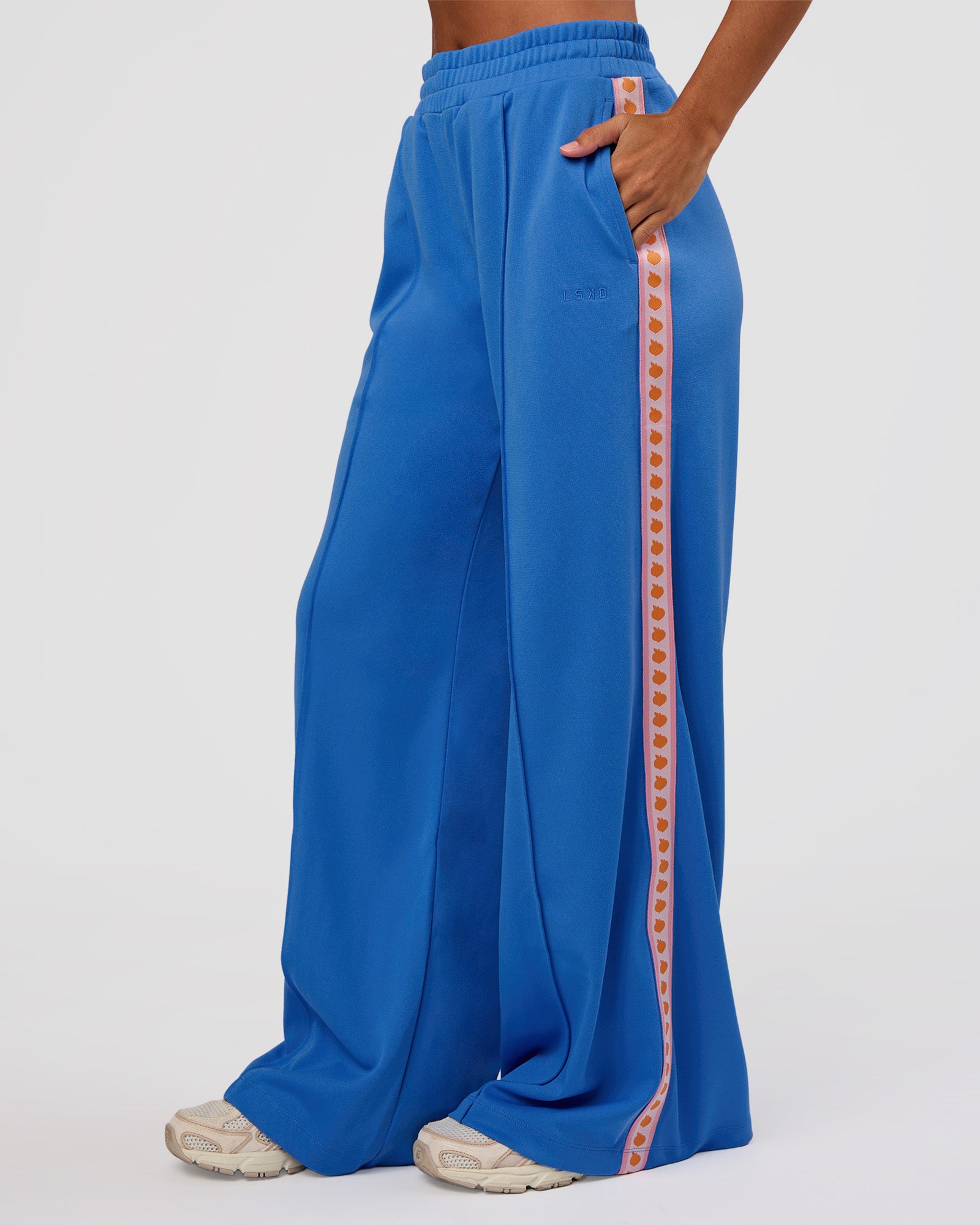 Woman wearing Peaches Track Pant - Palace Blue | Model:Brylee | Size:XS
