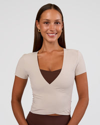 Woman wearing Peaches Wrap Cinch Top - Shale Beige | Model:Brylee | Size:XS