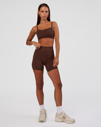 Woman wearing Peaches Wrap Sports Bra - Hot Chocolate | Model:Brylee | Size:XS
