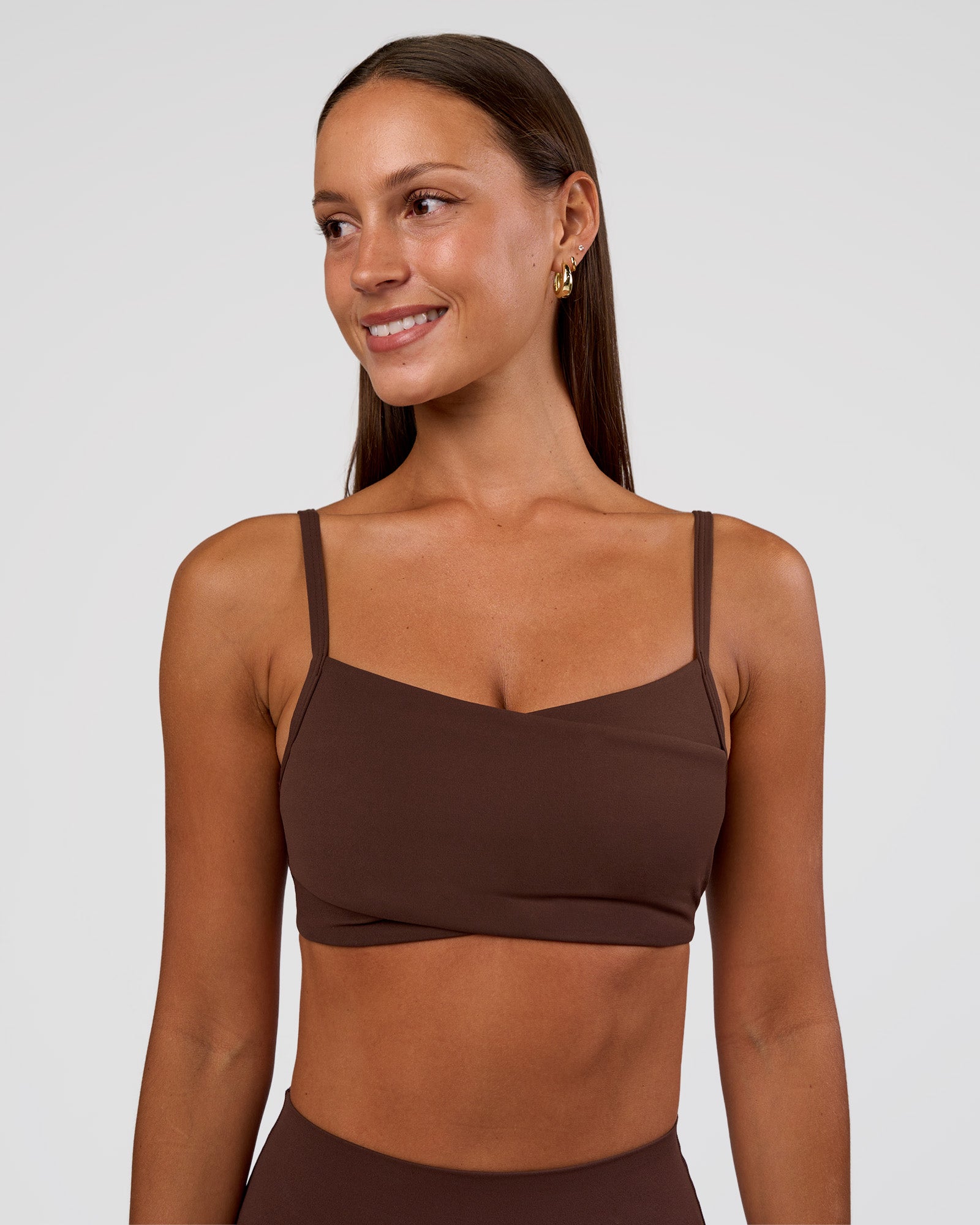 Woman wearing Peaches Wrap Sports Bra - Hot Chocolate | Model:Brylee | Size:XS