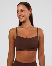 Woman wearing Peaches Wrap Sports Bra - Hot Chocolate | Model:Brylee | Size:XS