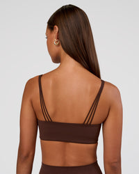 Woman wearing Peaches Wrap Sports Bra - Hot Chocolate | Model:Brylee | Size:XS