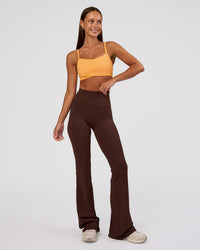 Woman wearing Peaches Wrap Sports Bra - Warm Apricot | Model:Brylee | Size:XS