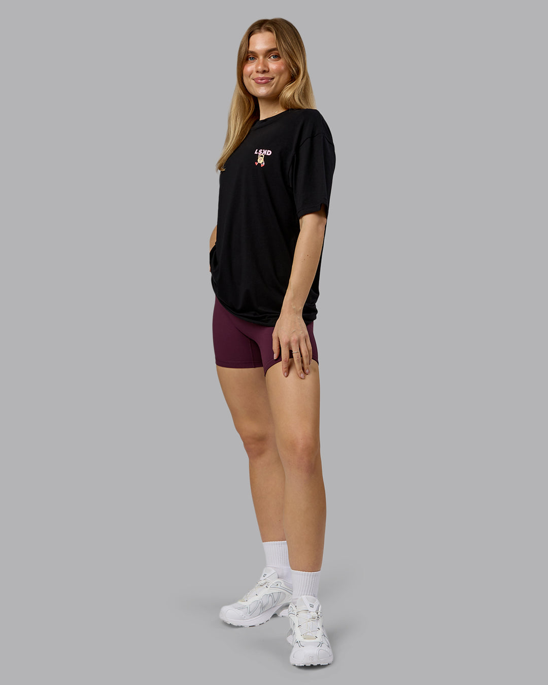 Woman wearing Perspective FLXCotton Oversized Tee - Black-Soft Pink | Model:Emilie | Size:XS