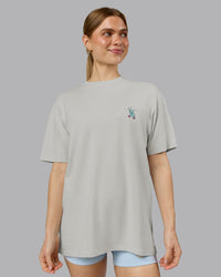 Woman wearing Perspective FLXCotton Oversized Tee - Digital Mist-White | Model:Emilie | Size:XS
