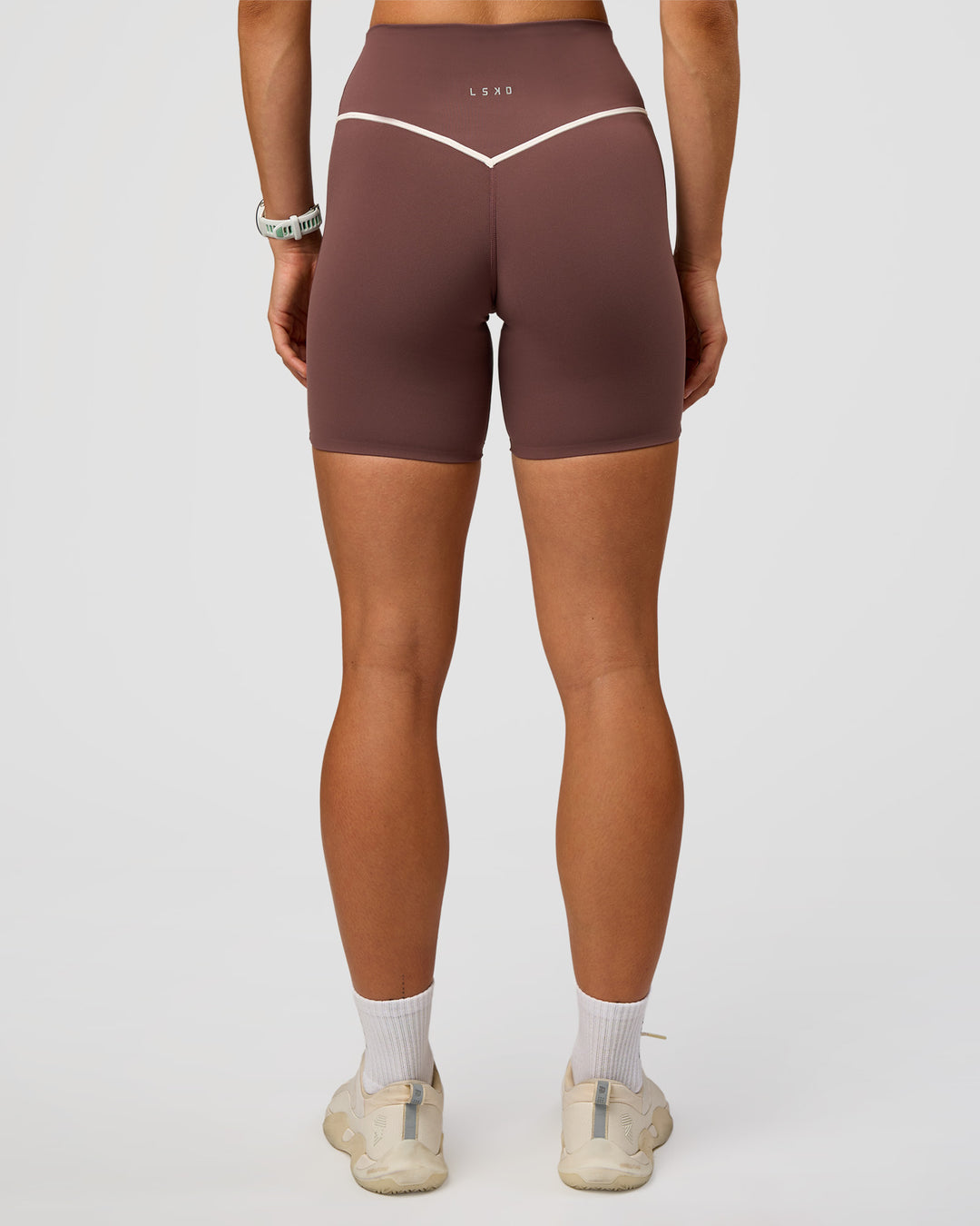 Woman wearing Pinnacle High-Rise 6" Short - Cocoa Powder-Off White | Model:Maja | Size:XS