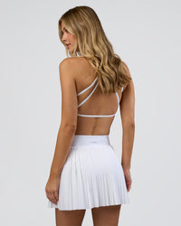 Woman wearing Precision Active Skirt - White | Model:Leilani | Size:XS