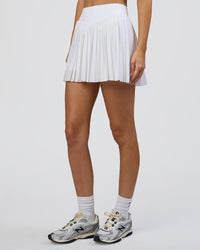 Woman wearing Precision Active Skirt - White | Model:Leilani | Size:XS