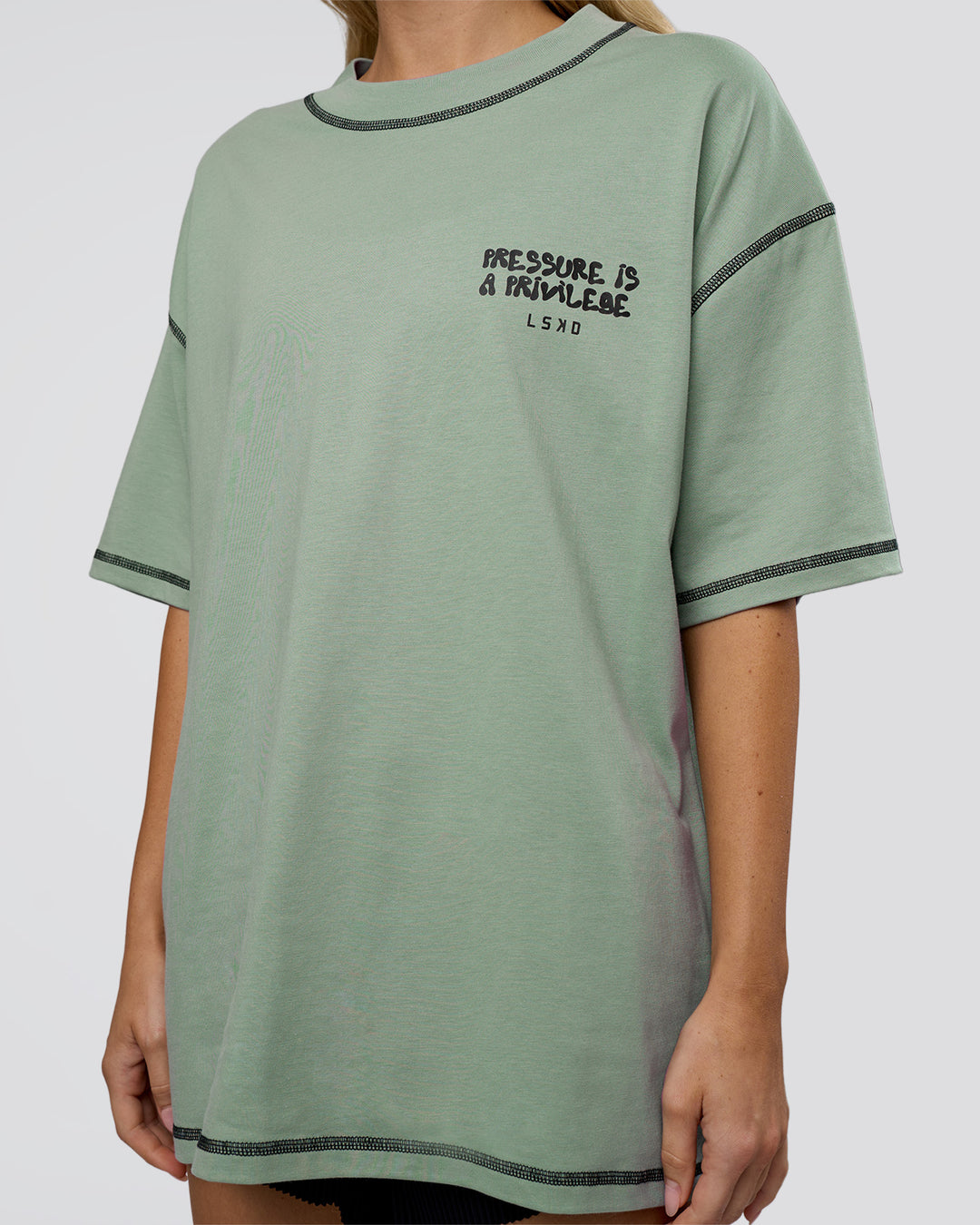 Woman wearing Pressure is Privilege Oversized Tee - Iceberg Green-Black | Model:Leilani | Size:XS