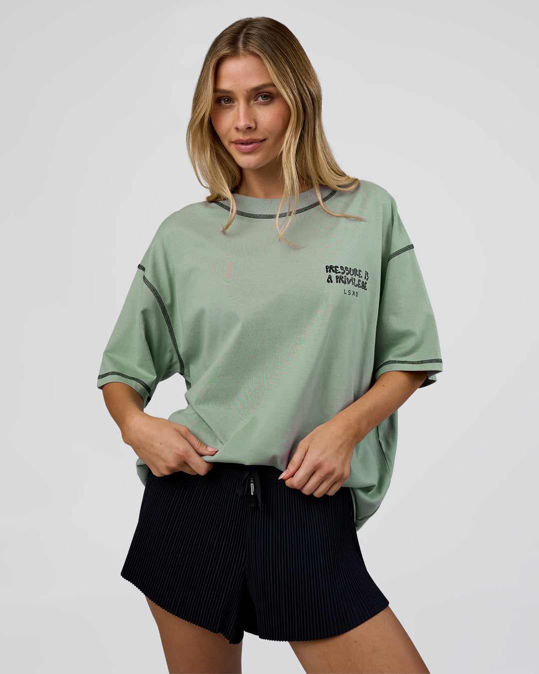 Woman wearing Pressure is Privilege Oversized Tee - Iceberg Green-Black | Model:Leilani | Size:XS