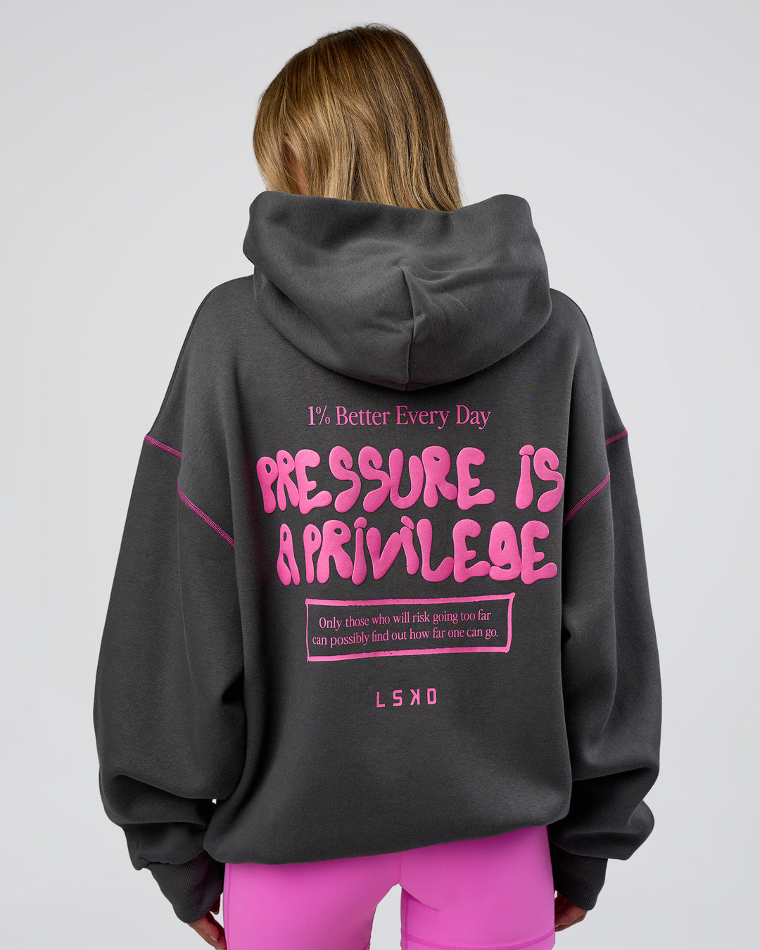 Woman wearing Pressure is Privilege Oversized Hoodie - Dark Storm-Ultra Fuchsia | Model:Leilani | Size:XS