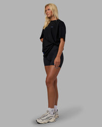 Woman wearing Pressure is a Privilege FLXCotton Oversized Tee - Black-Power Cobalt | Model:Alex | Size:XS