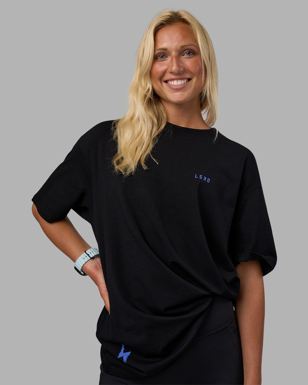 Woman wearing Pressure is a Privilege FLXCotton Oversized Tee - Black-Power Cobalt | Model:Alex | Size:XS