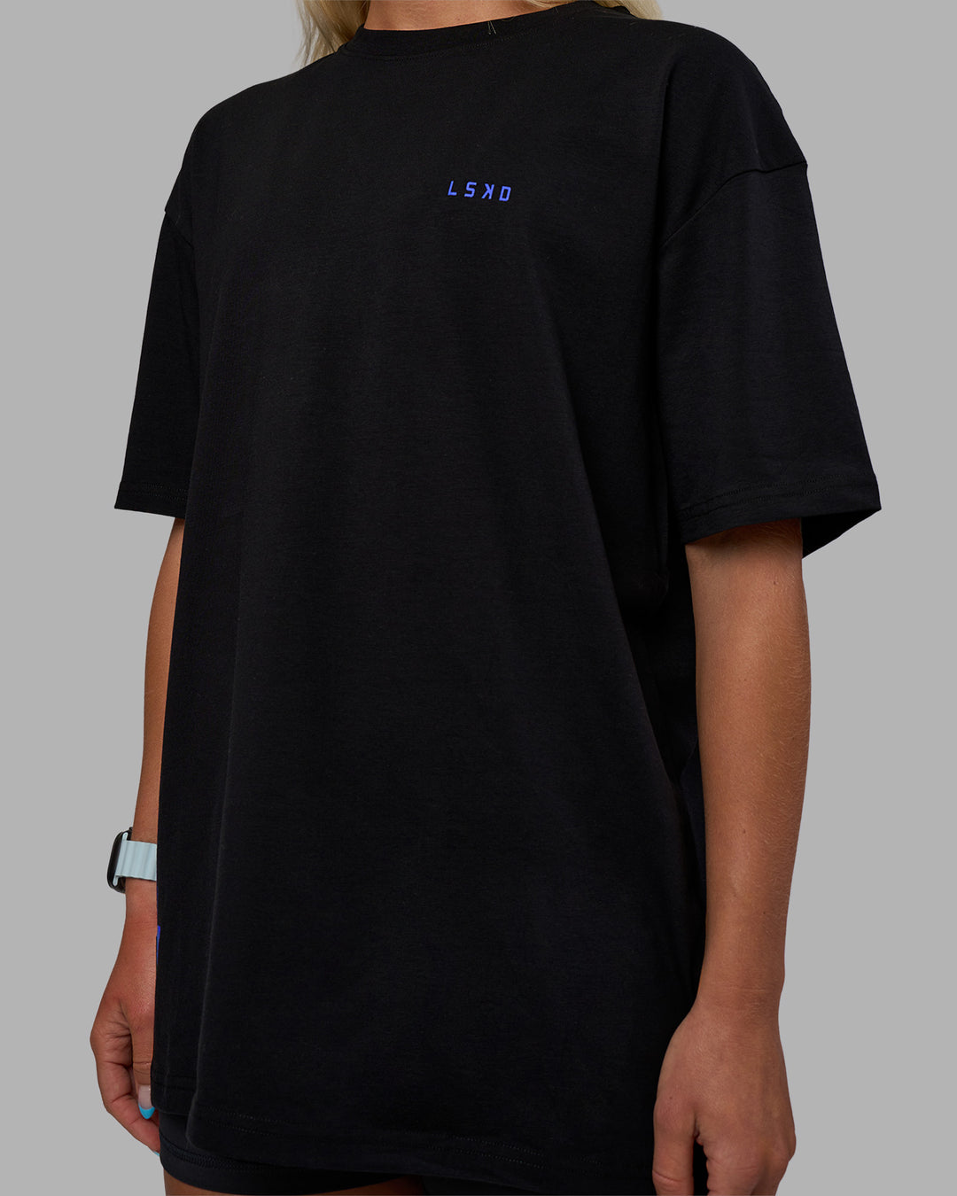 Woman wearing Pressure is a Privilege FLXCotton Oversized Tee - Black-Power Cobalt | Model:Alex | Size:XS