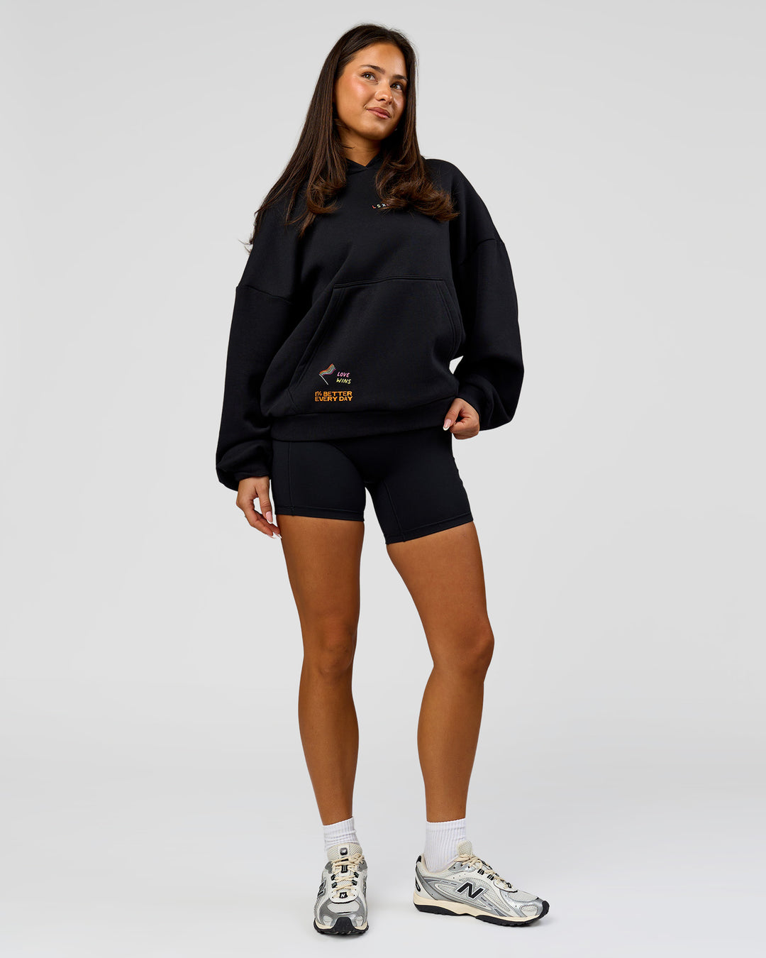 Woman wearing Pride Sticker Boxy Hoodie - Black | Model:Bianca | Size:XS