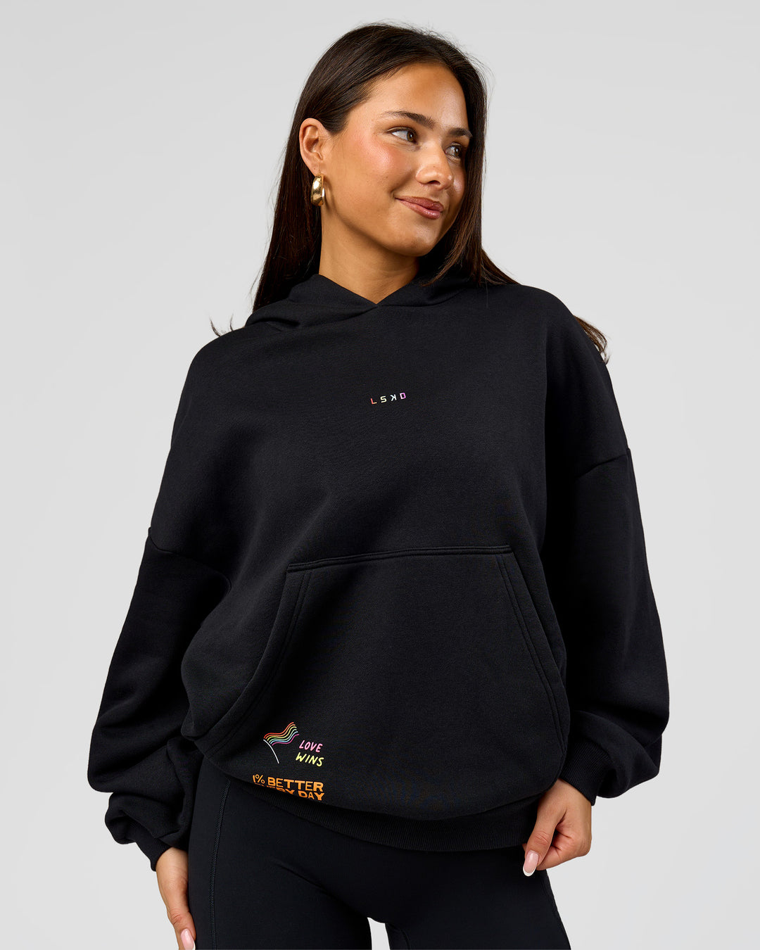 Woman wearing Pride Sticker Boxy Hoodie - Black | Model:Bianca | Size:XS