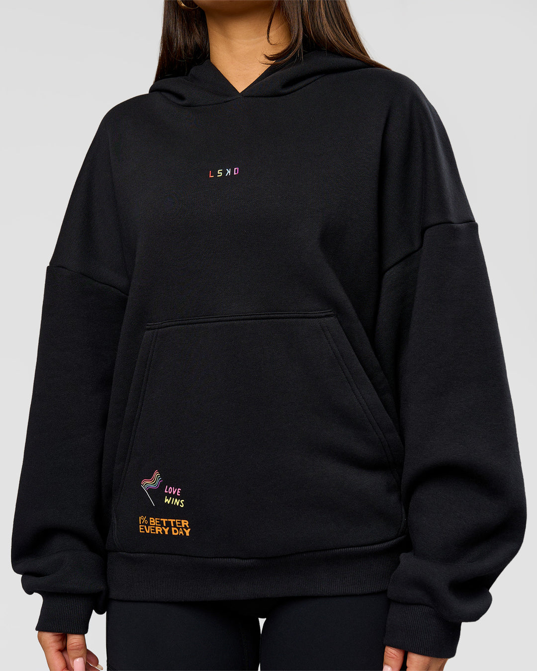 Woman wearing Pride Sticker Boxy Hoodie - Black | Model:Bianca | Size:XS