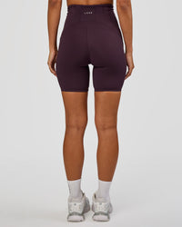 Woman wearing Progression Ultra High-Rise 6" Short - Midnight Plum | Mode:Brylee | Size:XS