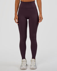 Woman wearing Progression Ultra High-Rise Full Length Legging - Midnight Plum | Model:Brylee | Size:XS