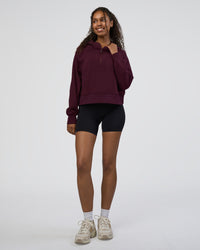 Woman wearing Pursue Mid-Weight Hoodie - Cherry Lacquer | Model:Jordan | Size:XS
