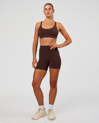Woman wearing Rapid Sports Bra - Hot Chocolate | Model:Emelia | Size:XS