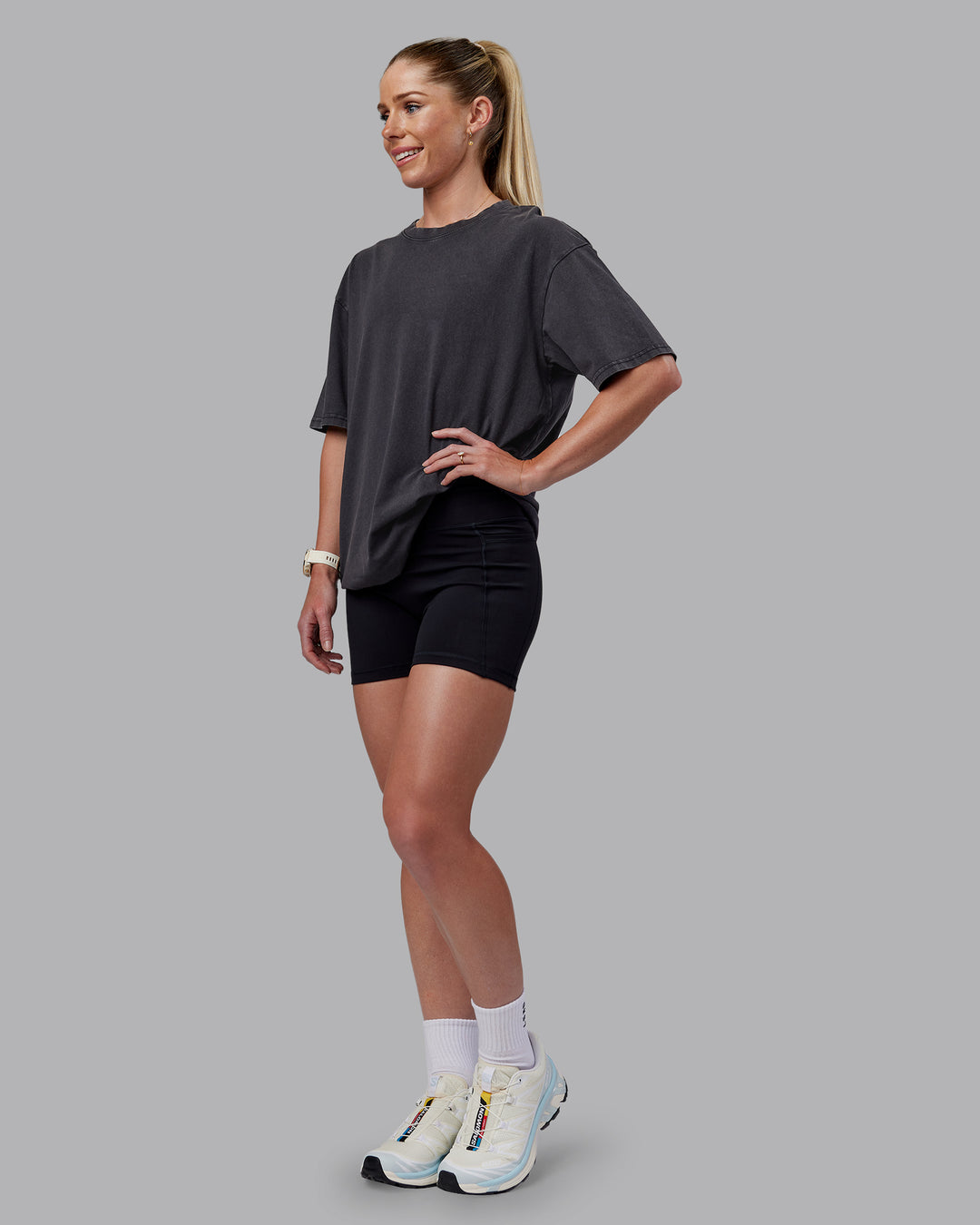 Woman wearing Relentless Washed FLXCotton Oversized Tee - Black-Ultimate Grey | Model:Kayti | Size:XS