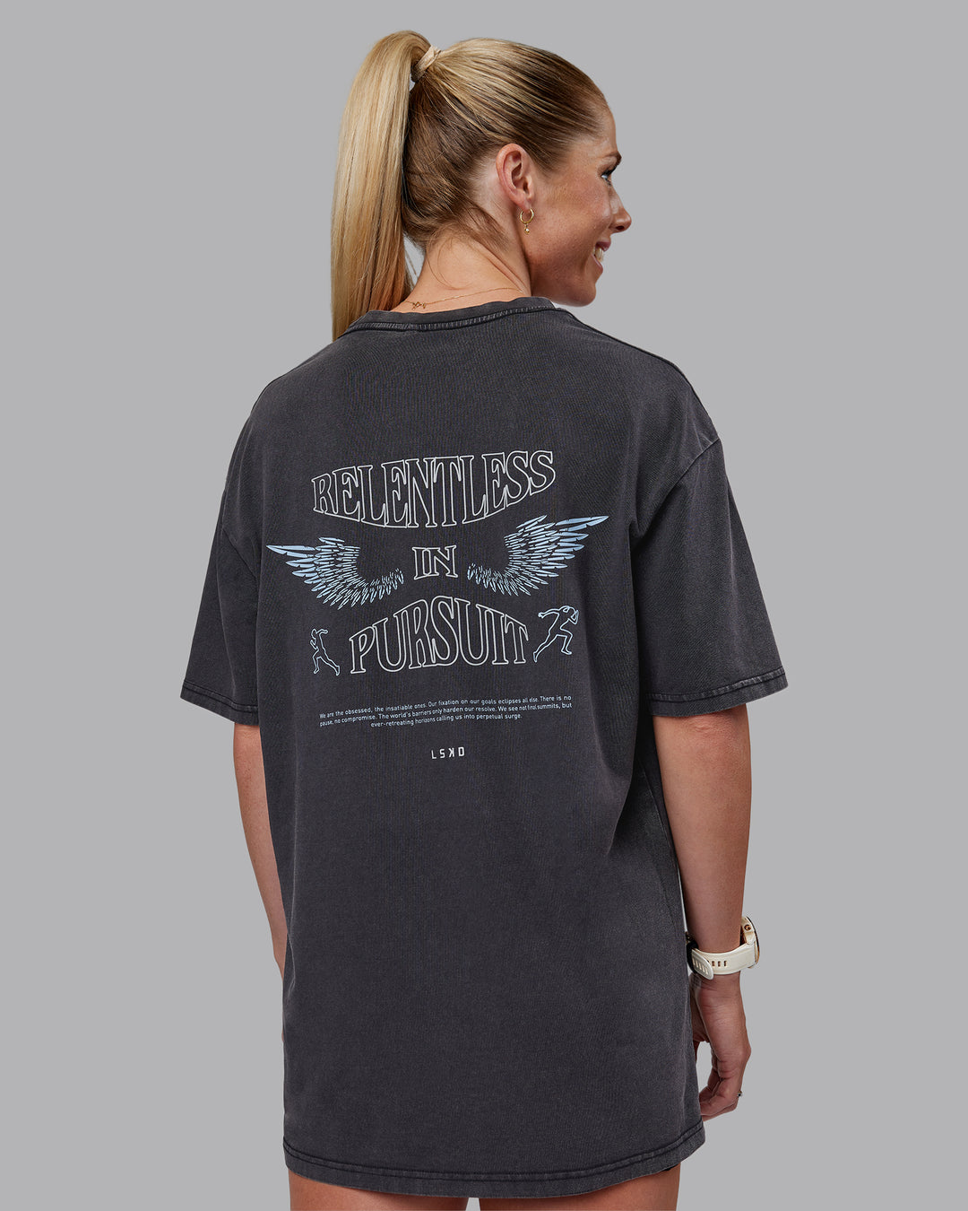 Woman wearing Relentless Washed FLXCotton Oversized Tee - Black-Ultimate Grey | Model:Kayti | Size:XS