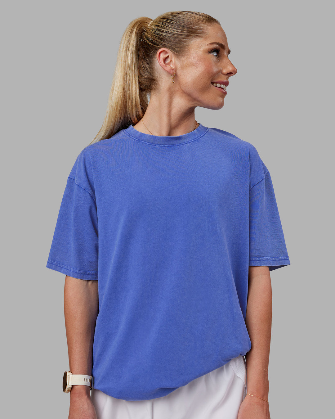 Woman wearing Relentless Washed FLXCotton Oversized Tee - Power Cobalt-White | Model:Kayti | Size:XS