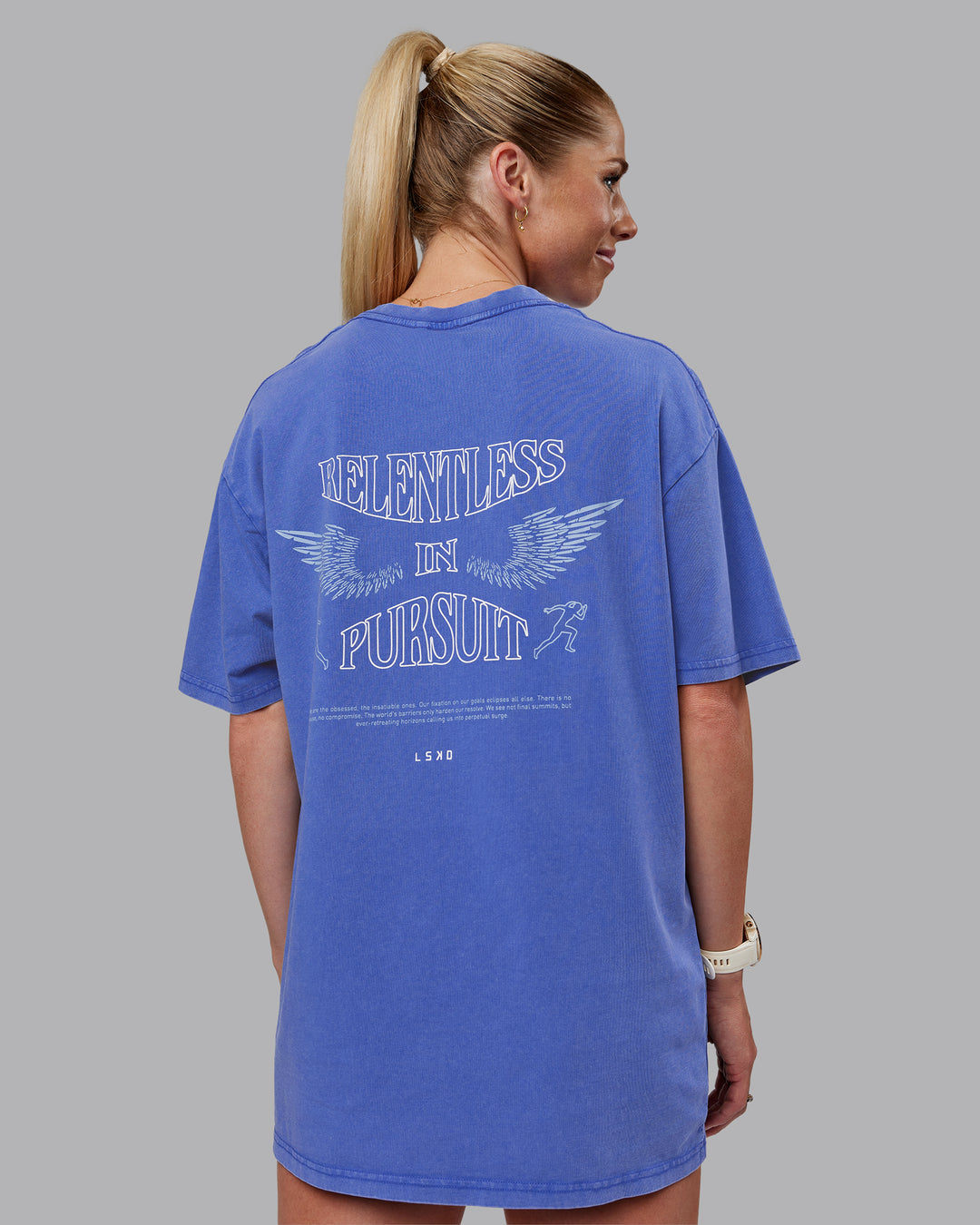 Woman wearing Relentless Washed FLXCotton Oversized Tee - Power Cobalt-White | Model:Kayti | Size:XS