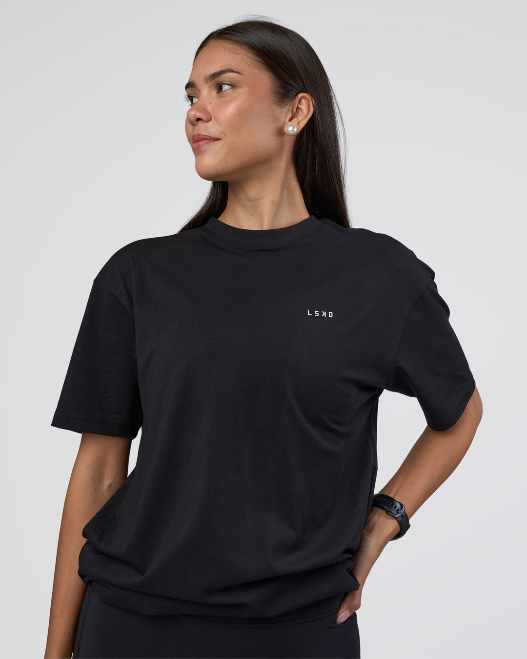 Woman wearing Research Department FLXCotton Oversized Tee - Black | Model:Rhiley | Size:XS