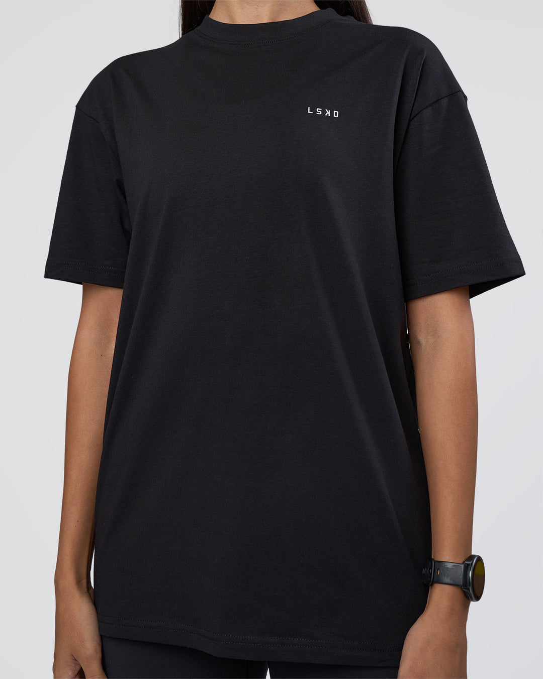 Woman wearing Research Department FLXCotton Oversized Tee - Black | Model:Rhiley | Size:XS