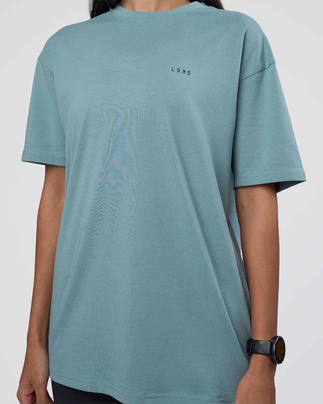 Woman wearing Research Department FLXCotton Oversized Tee - Smoke Blue | Model:Rhiley | Size:XS