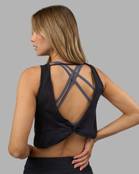 Woman wearing Restore CloudFLX Tank - Black | Model:Leilani | Size:XS
