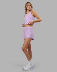 Woman wearing Restore CloudFLX Tank - Orchid Bloom Marl | Model:Leilani | Size:XS