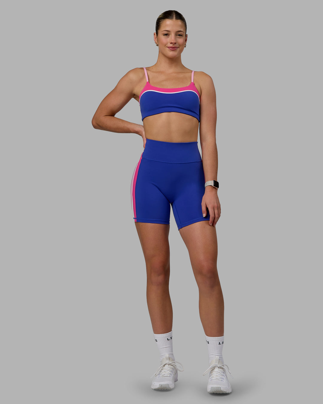 Woman wearing Revitalise Ultra High-Rise 6" Short - Power Cobalt-Fuchsia Pink