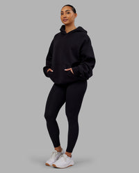Woman wearing Rise & Lift Hoodie Oversized - Black-White | Model:Ayla | Size:XS