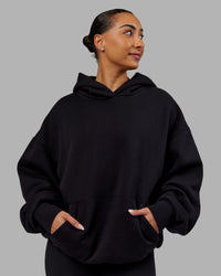 Woman wearing Rise & Lift Hoodie Oversized - Black-White | Model:Ayla | Size:XS