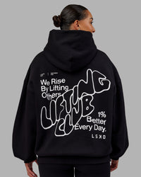 Woman wearing Rise & Lift Hoodie Oversized - Black-White | Model:Ayla | Size:XS