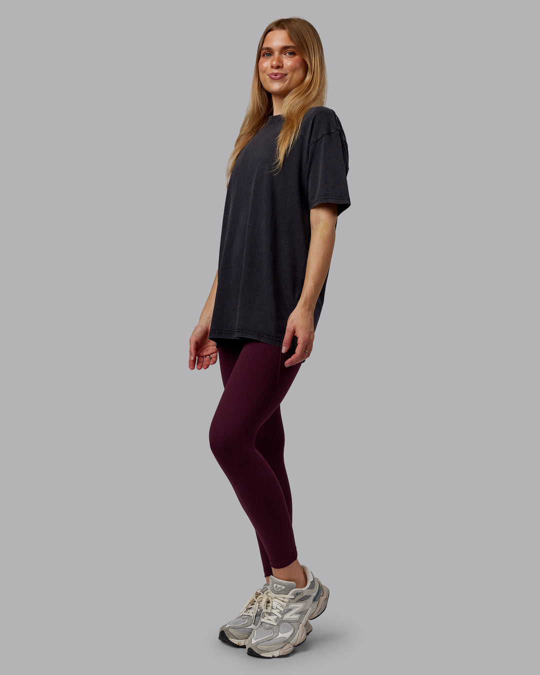 Woman wearing Rise &amp; Lift Washed FLXCotton Oversized Tee - Black-Plum Berry | Model:Emilie | Size:XS